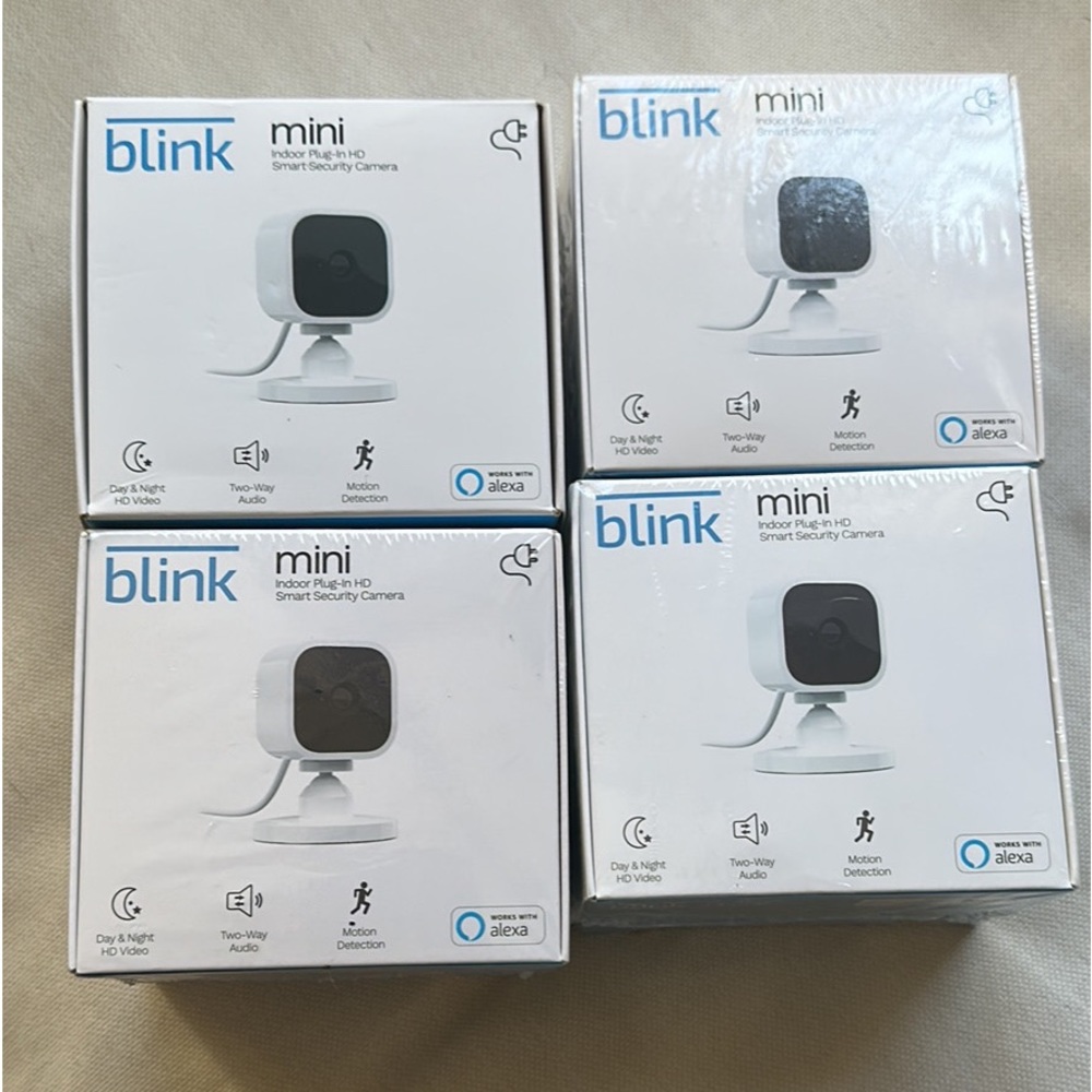 4 blink mini cameras, 3 sealed in package one was opened